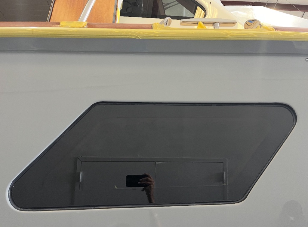 Hull window installation and fiberglass refinishing