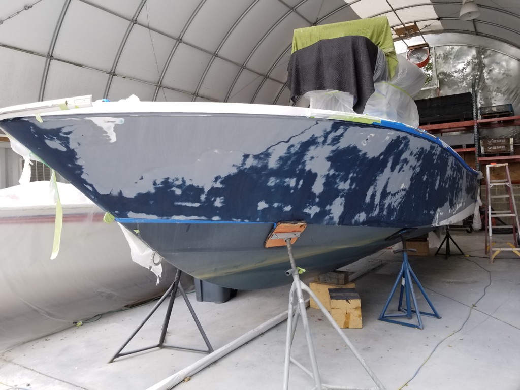 Sailing yacht hull fiberglass repair in progress