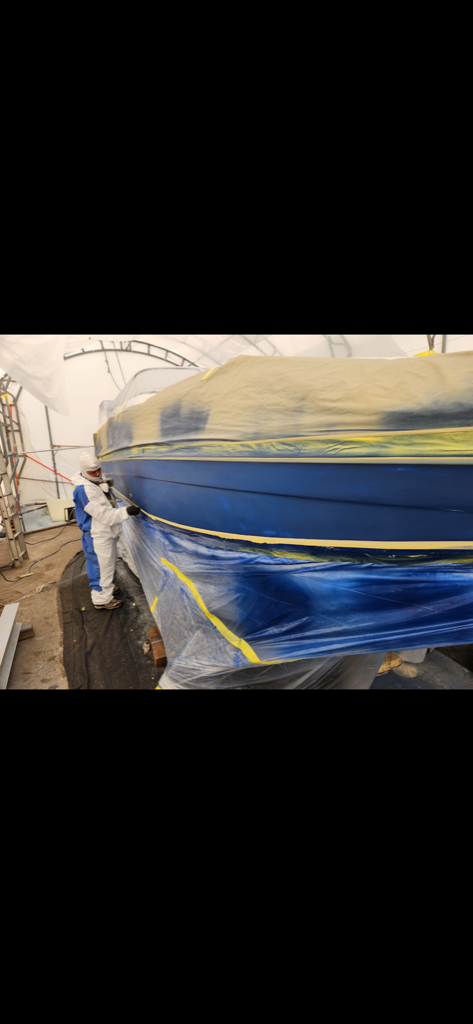 Boat hull paint preparation with masking