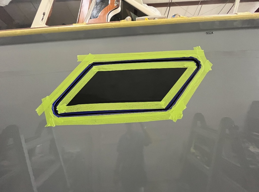 Window opening fiberglass repair with yellow tape protection