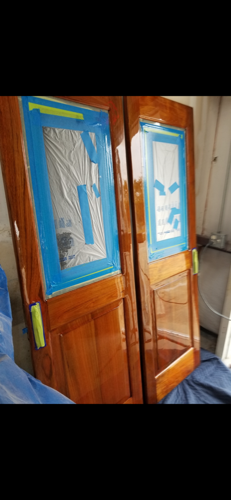 Custom yacht doors during refinishing process